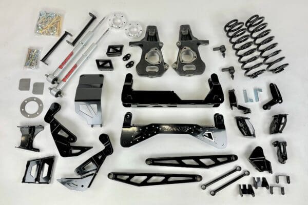 Black lift kit parts for a truck.