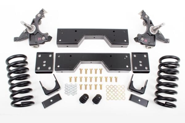 Car suspension lift kit with springs and hardware.