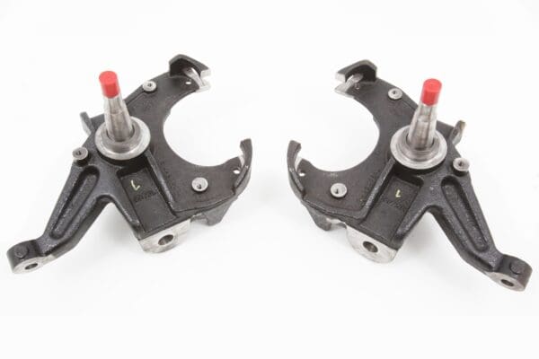 Pair of black car suspension parts.