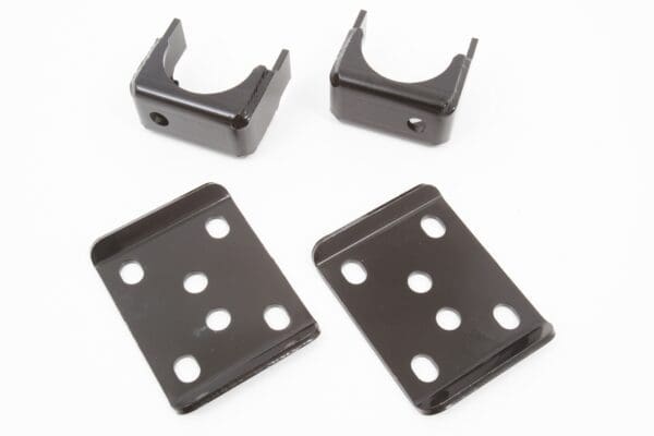 Four black metal brackets with holes.