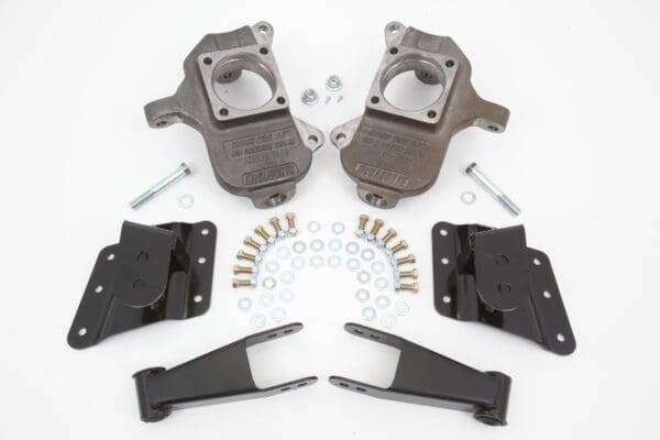 Suspension lift kit with hardware and brackets.