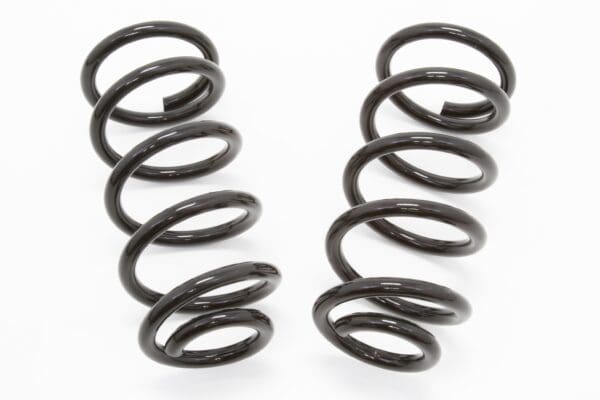 Two black coil springs on white background.