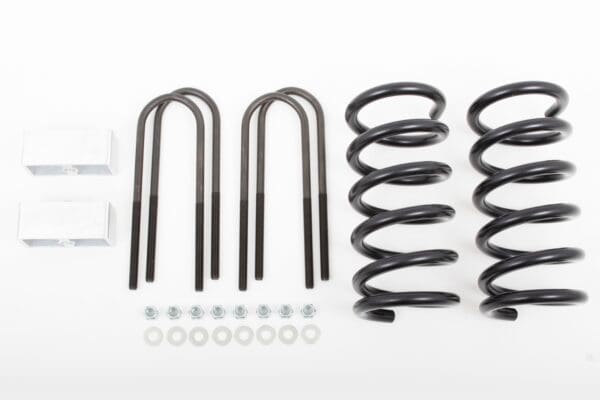 Black coil springs and lift kit parts.