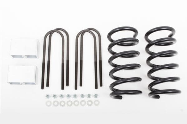 Truck lift kit with springs, U-bolts, and hardware.