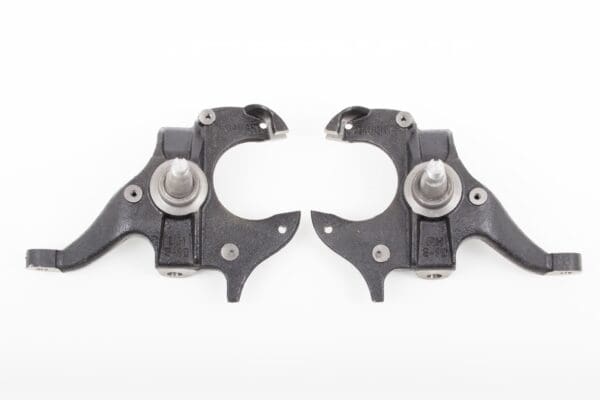 Pair of black S-10 suspension control arms.