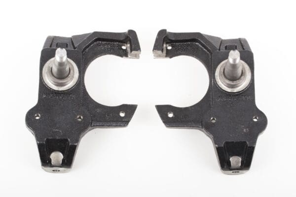 Black metal suspension parts with studs.