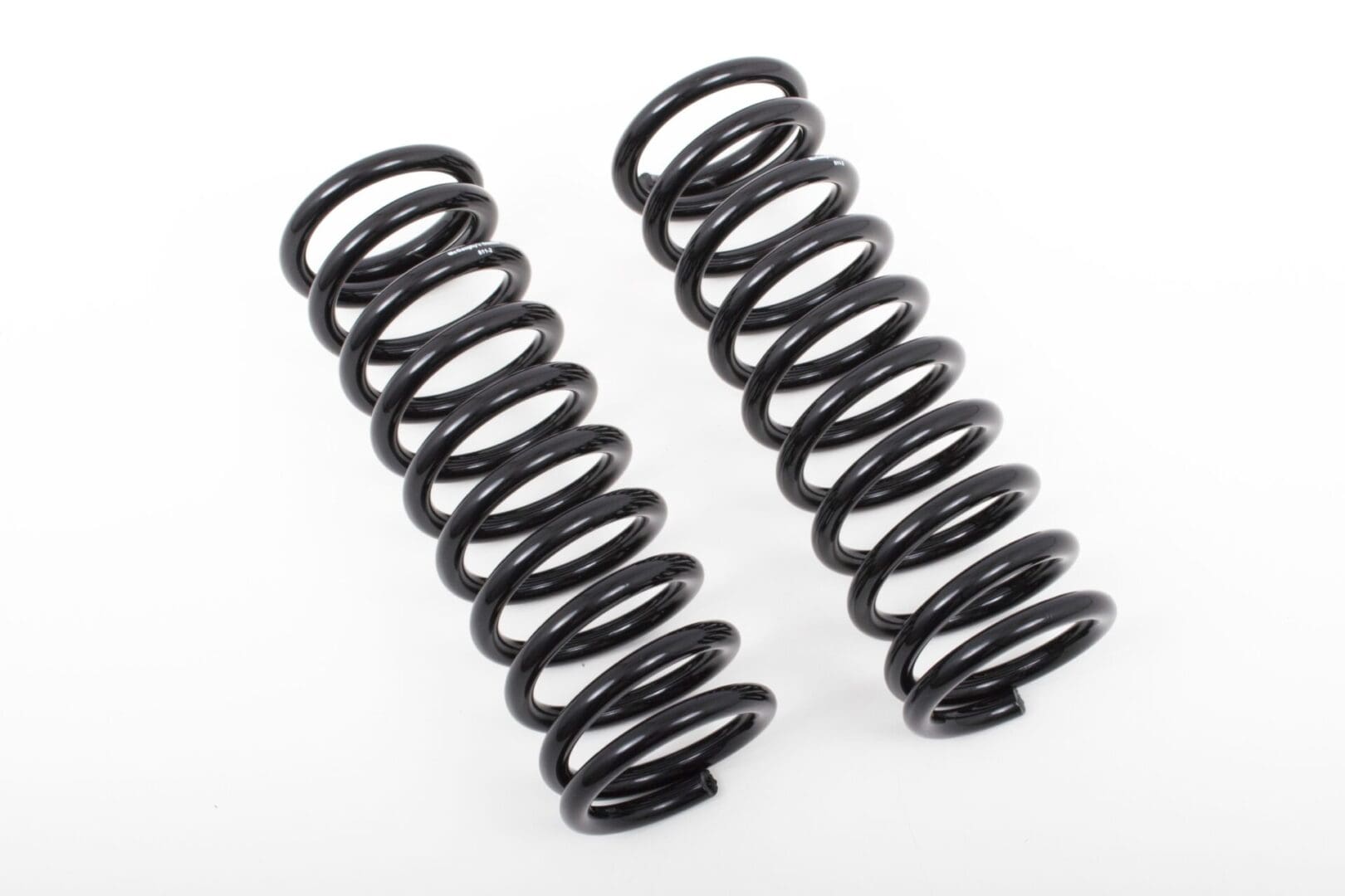 Two black coil springs on white background.