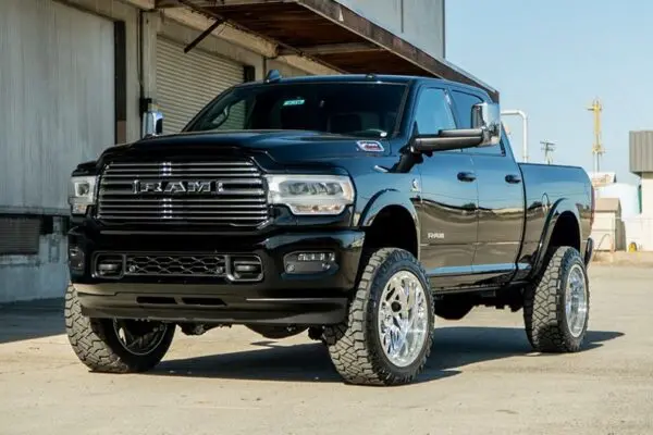 Black Ram pickup truck with chrome wheels.