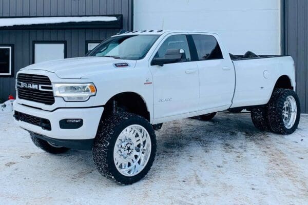 White Ram 3500 pickup truck in snow.