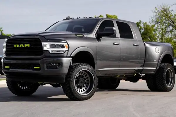 Gray Ram pickup truck with black wheels.