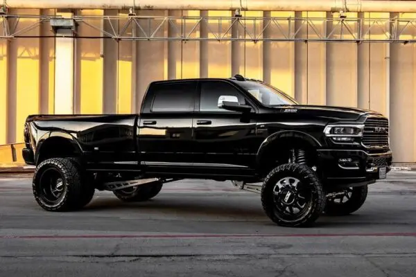 Black Ram pickup truck with large tires.