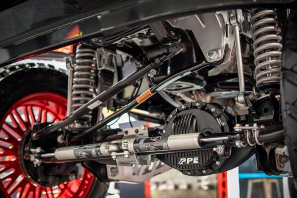 Close-up of a truck's rear axle and suspension.