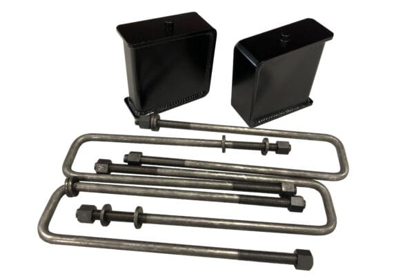 Truck lift kit with U-bolts and blocks.