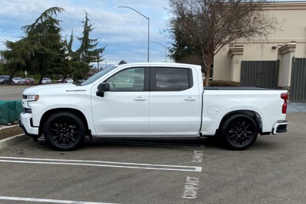 White Chevrolet Silverado pickup truck.