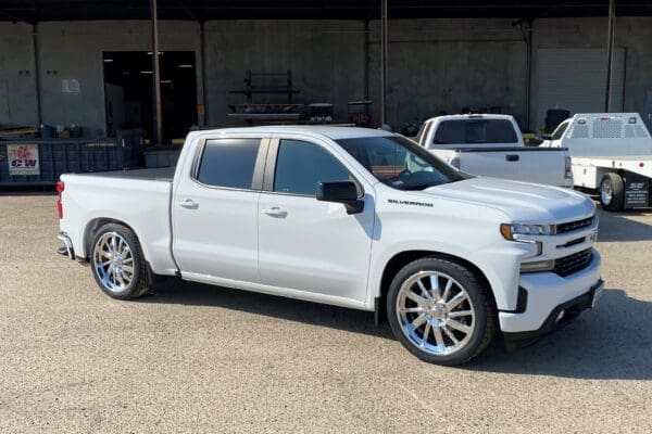 White Chevrolet Silverado pickup truck.