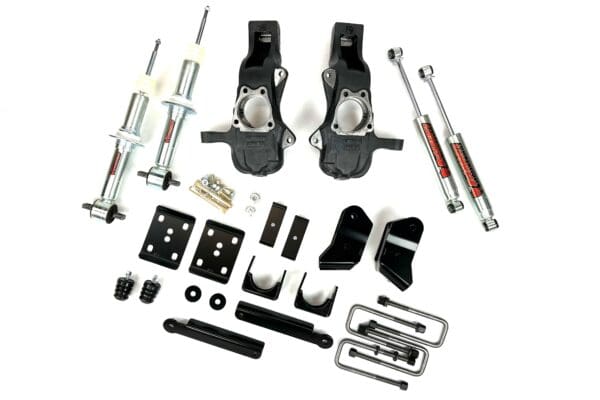 Truck lift kit with shocks and brackets.