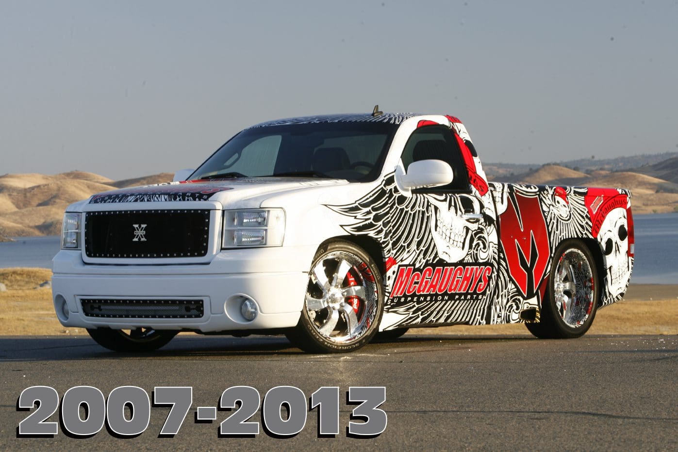 White pickup truck with custom paint.