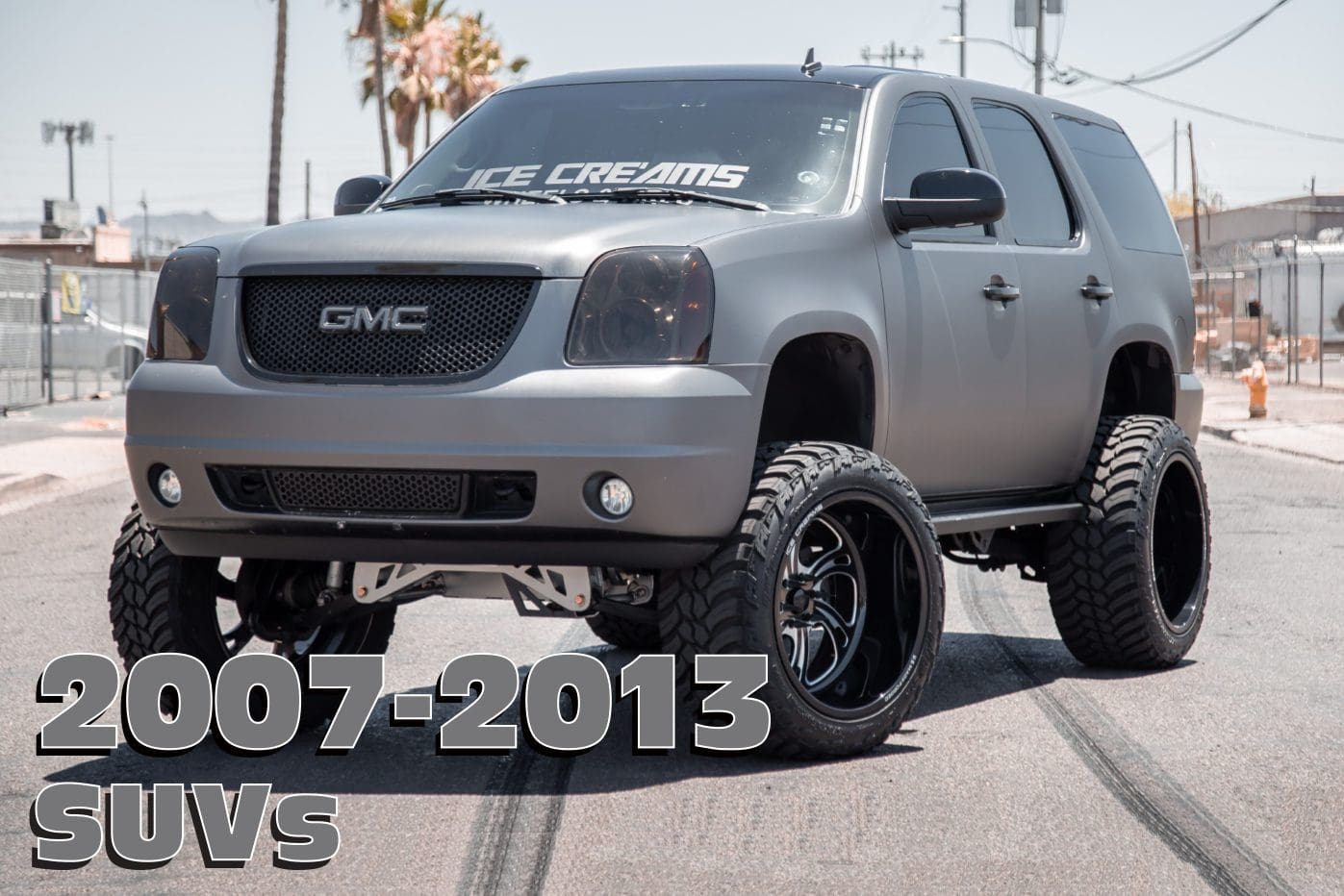 Gray GMC SUV with black wheels.