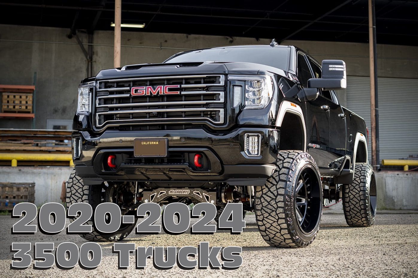 Black GMC 3500 truck with lifted suspension.