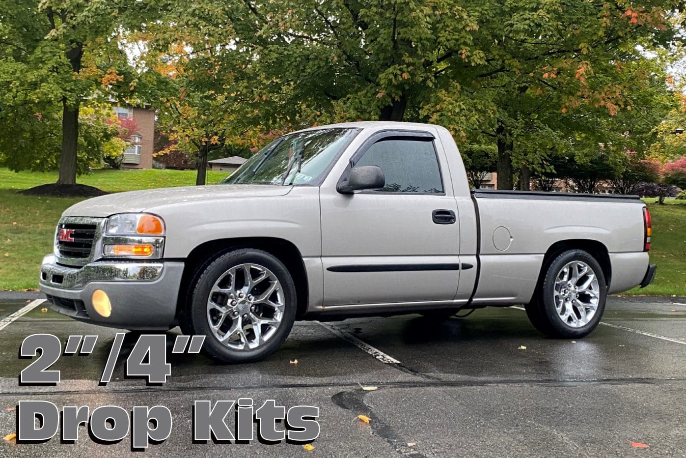 Silver pickup truck with drop kits.