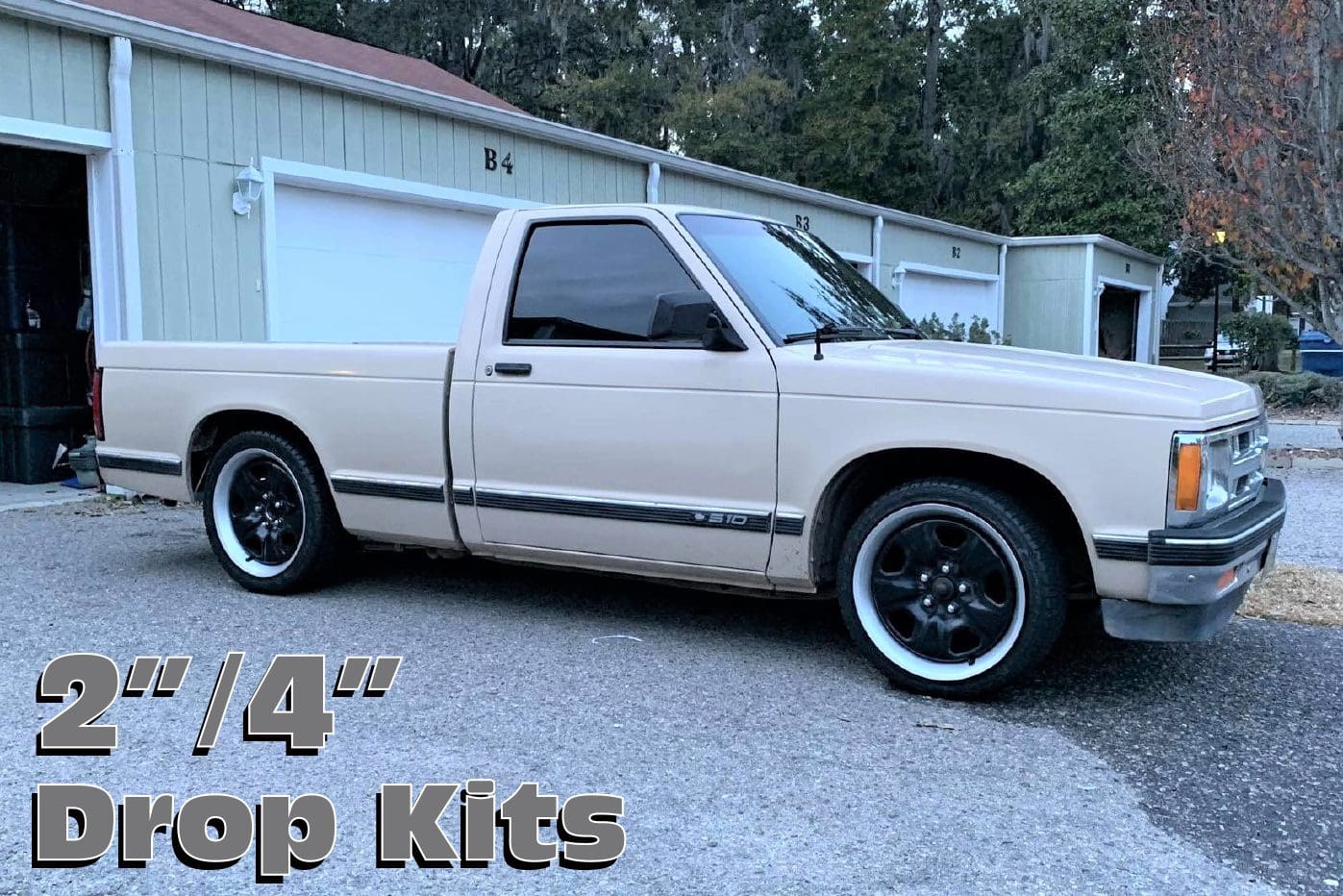 Beige pickup truck with black wheels.