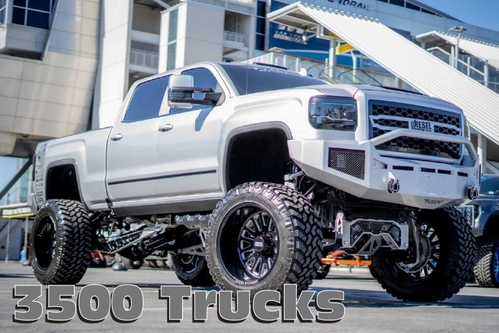 White lifted GMC 3500 pickup truck.