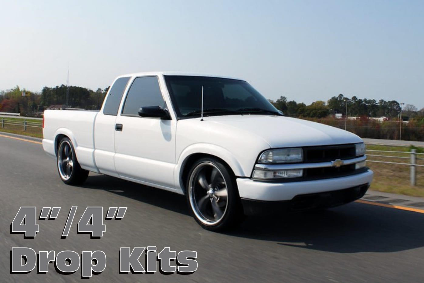 White Chevrolet S-10 pickup truck on road.