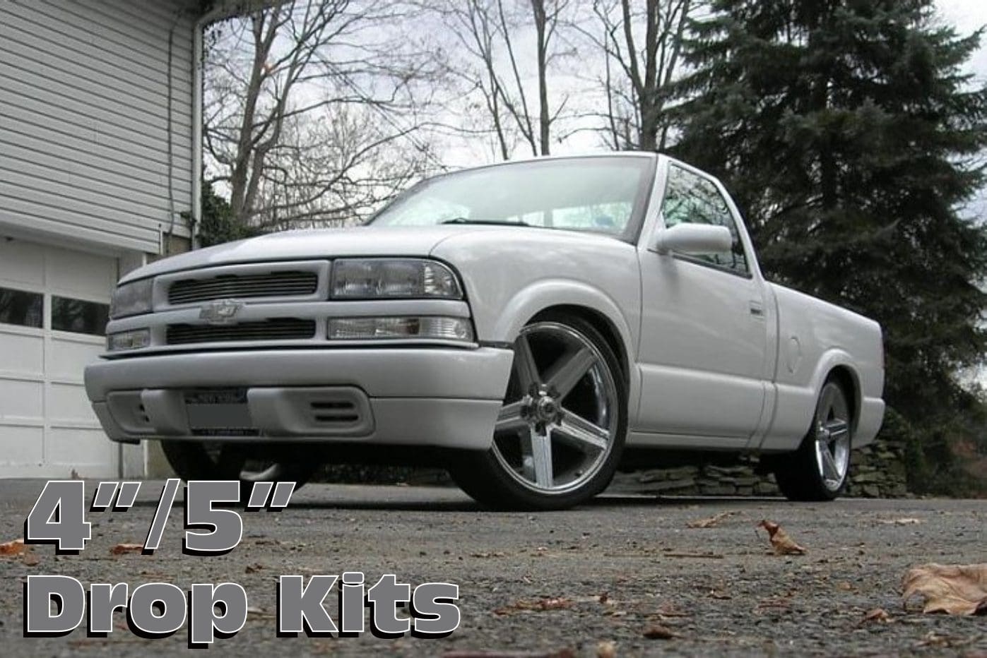 White pickup truck with drop kits.