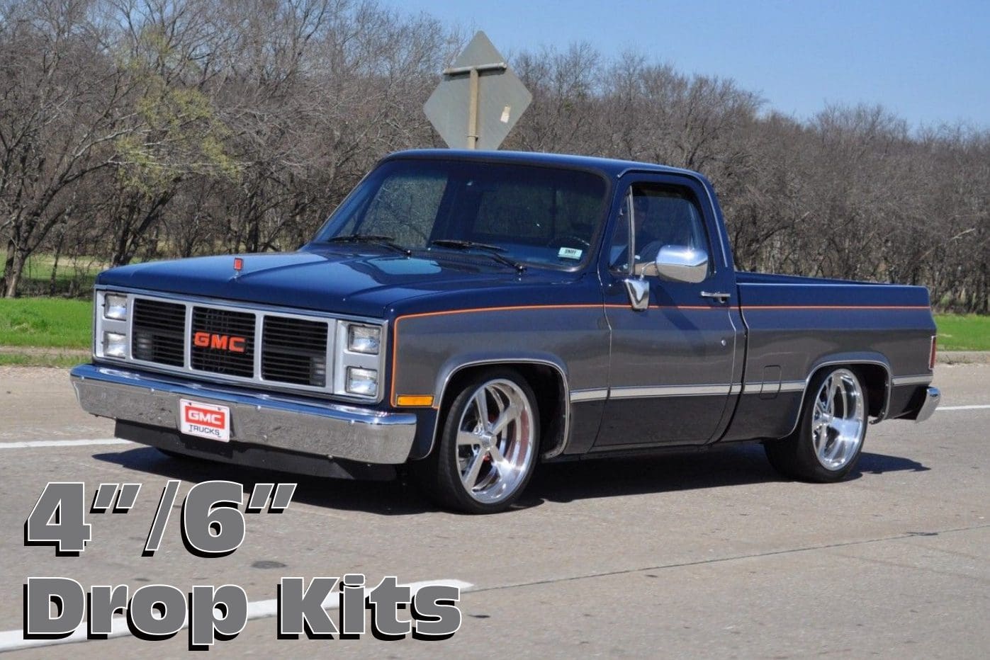 Blue GMC pickup truck with drop kit.