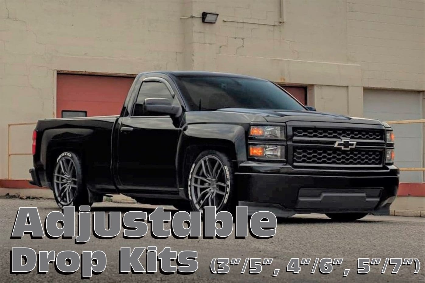 Black pickup truck with drop kit.