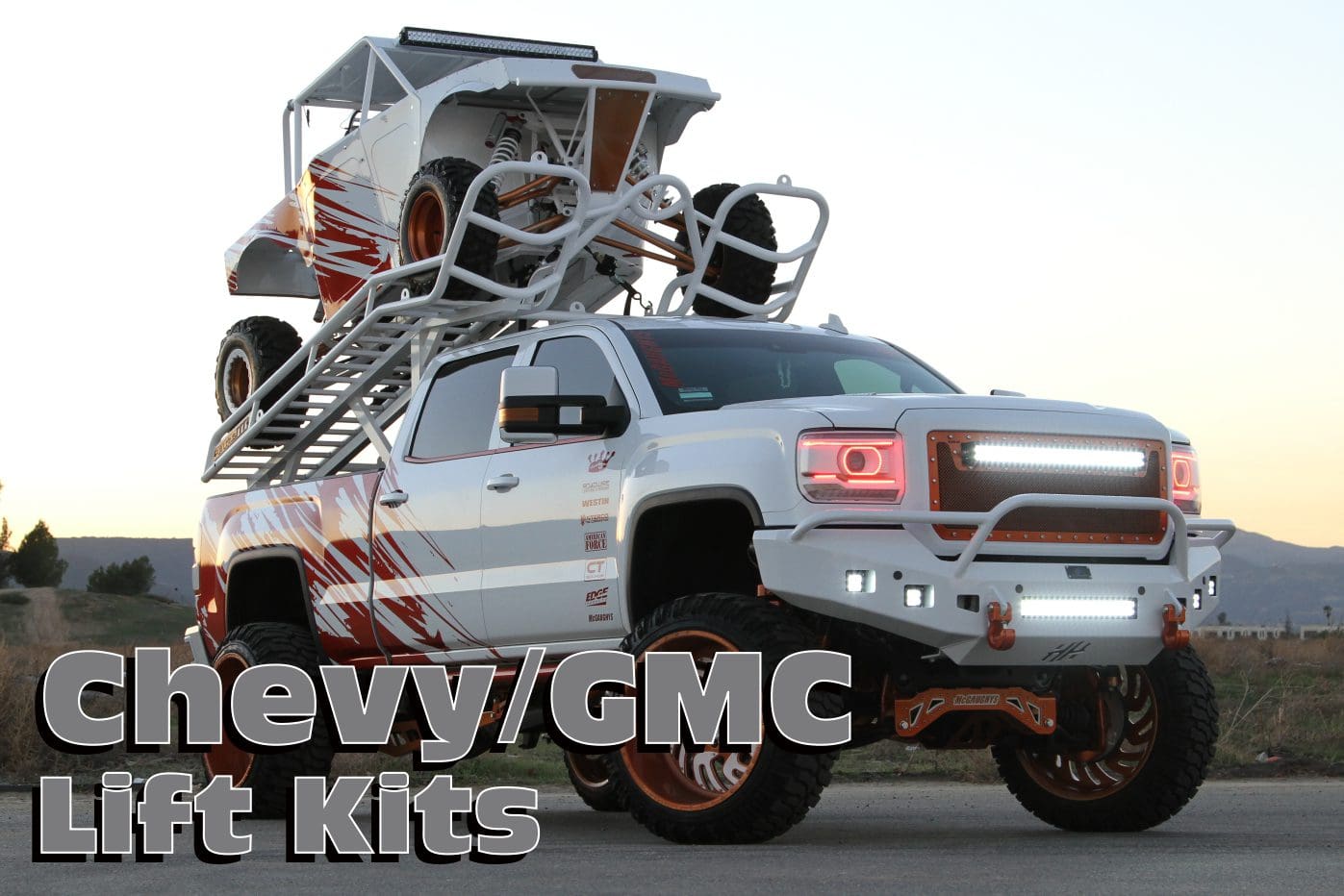 White Chevy/GMC truck with lift kit.