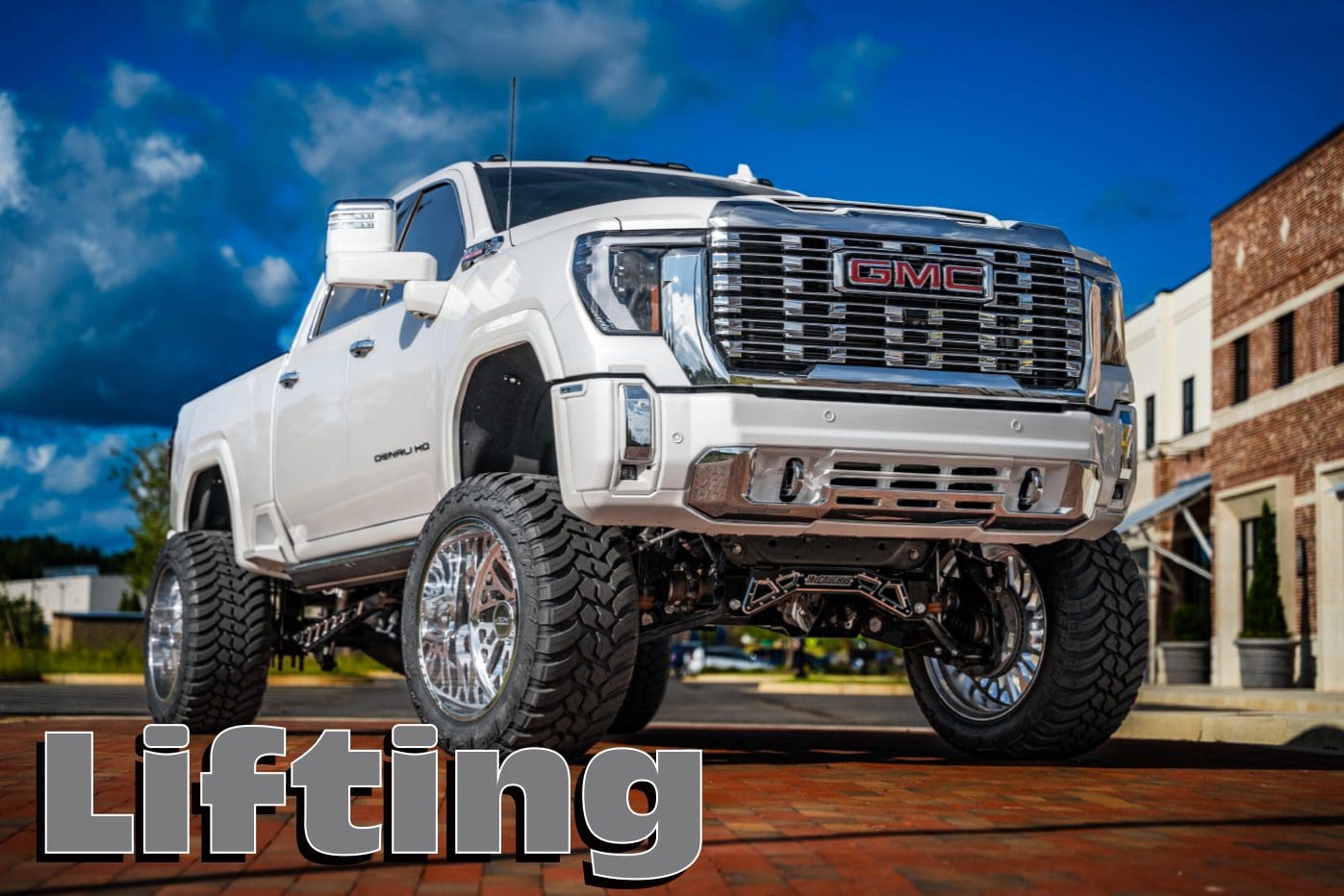 White GMC Denali HD lifted truck