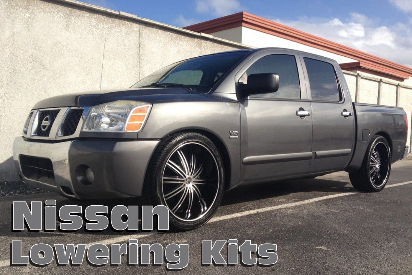 Gray Nissan Titan pickup truck with black rims.