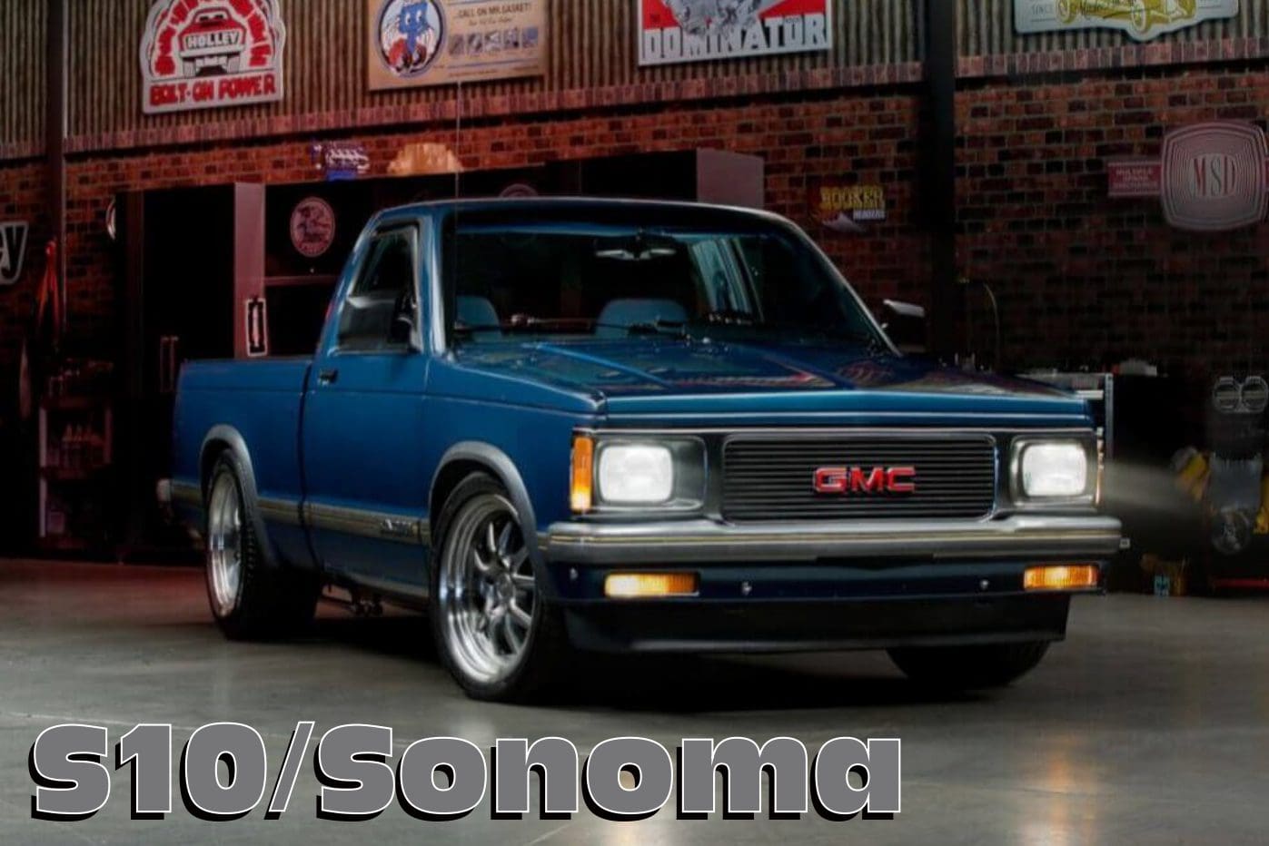 Blue GMC S10/Sonoma pickup truck.