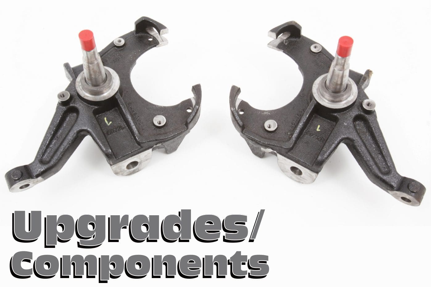 Pair of black spindle suspension parts.