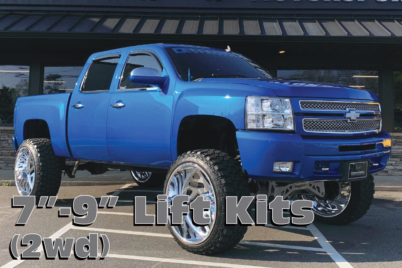 Blue Chevrolet Silverado with lift kit.