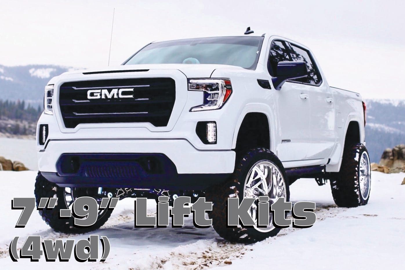 White GMC pickup truck with lift kit.