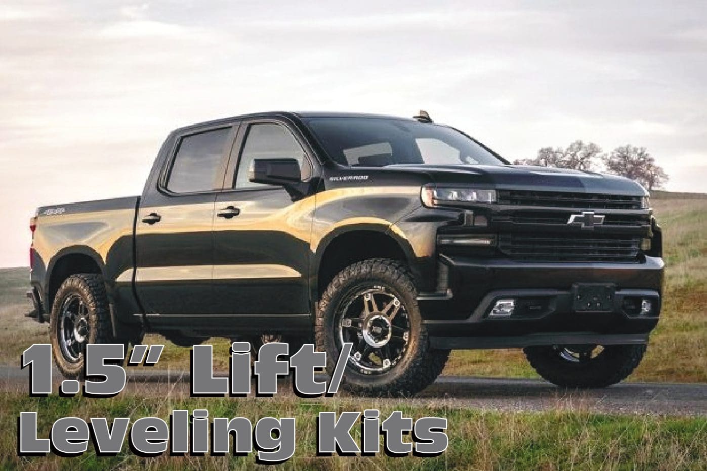 Black Chevrolet Silverado pickup truck with lift kit.