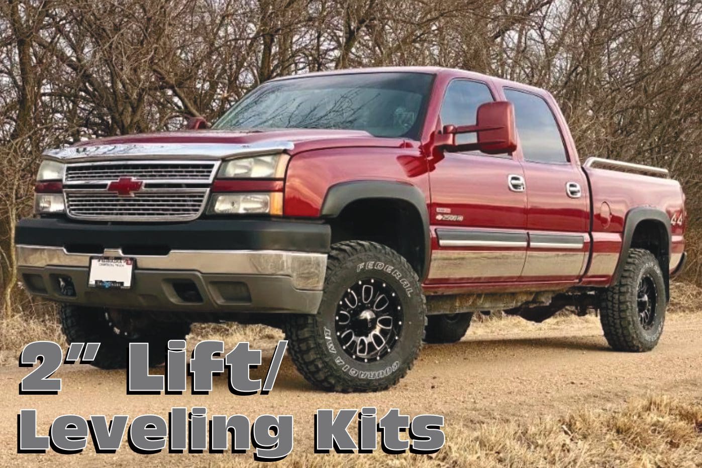 Red Chevrolet Silverado pickup truck with lift kit.