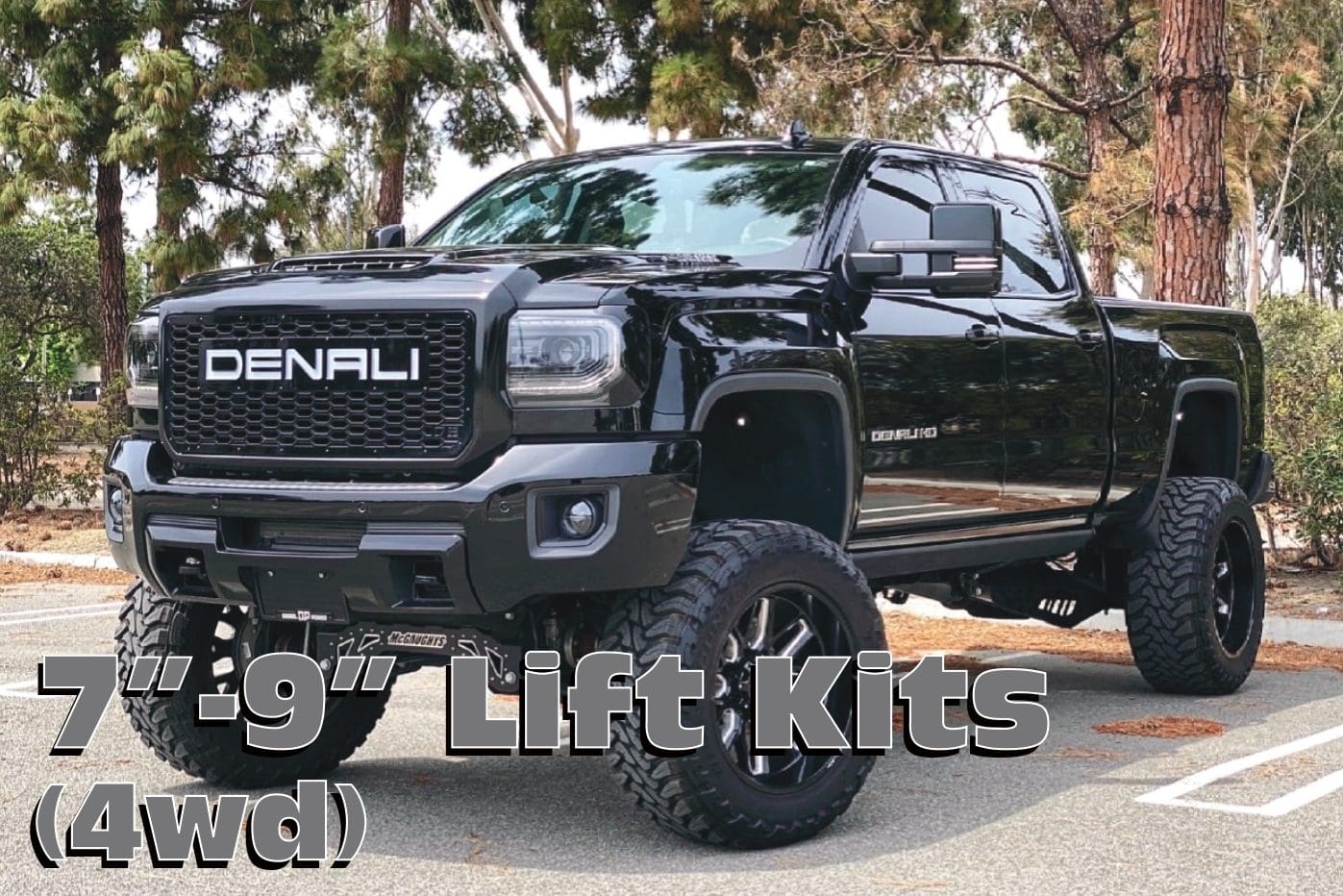 Black GMC Denali truck with lift kit.