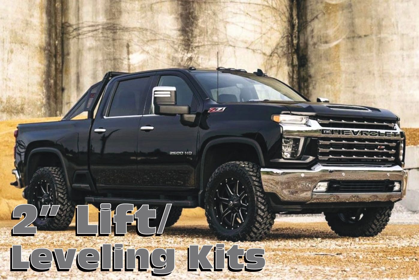 Black Chevrolet Silverado pickup truck with lift kit.