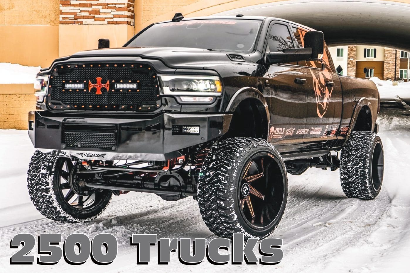 Black Ram 2500 truck with large tires.