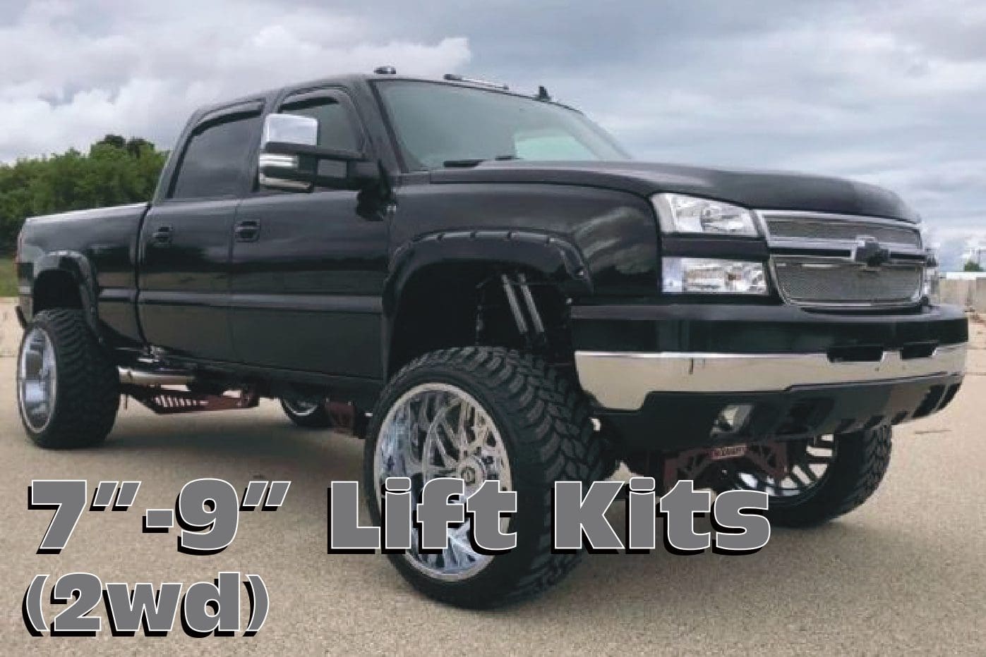 Black truck with lift kit and large wheels.