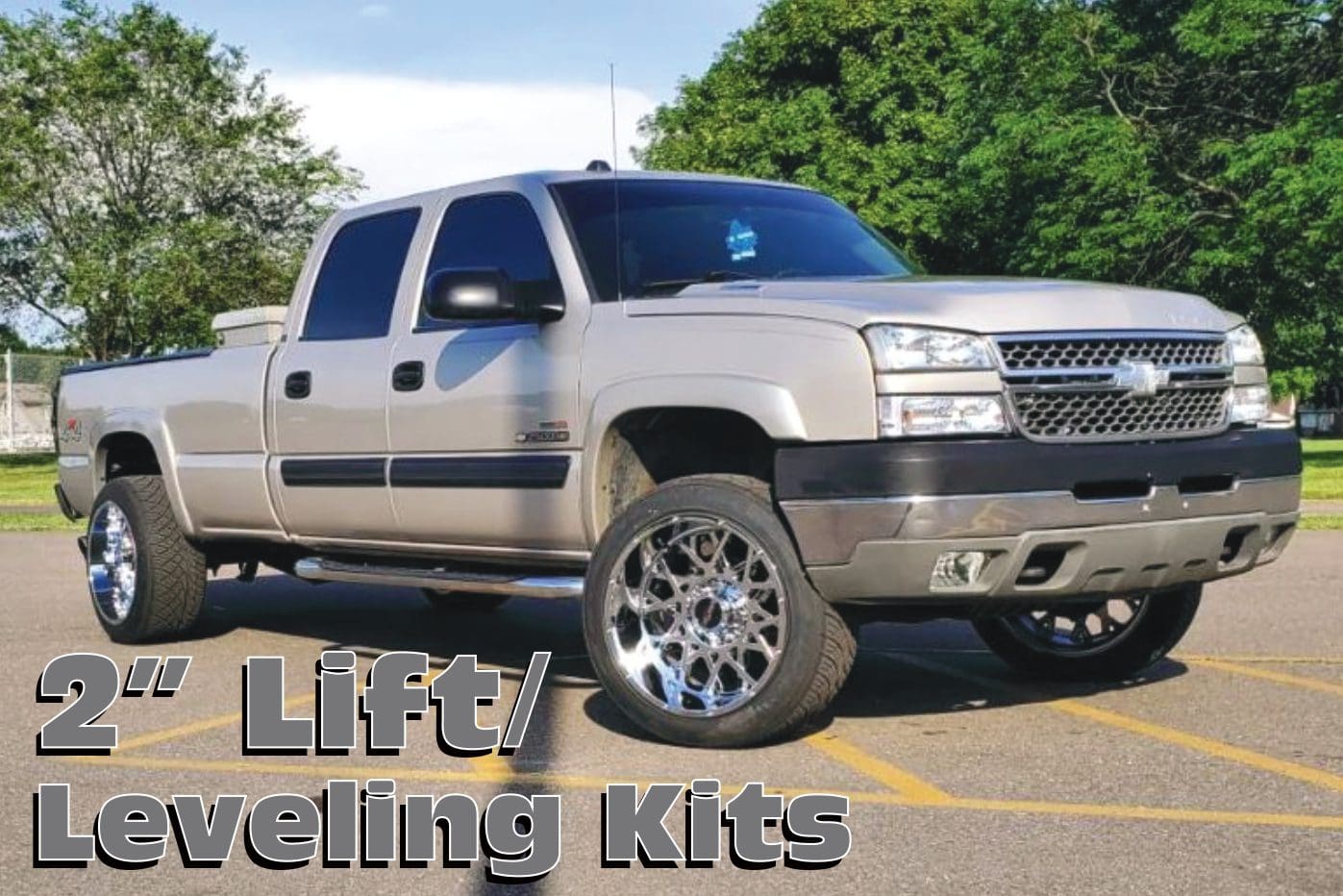 Silver Chevrolet pickup truck with lift kit.