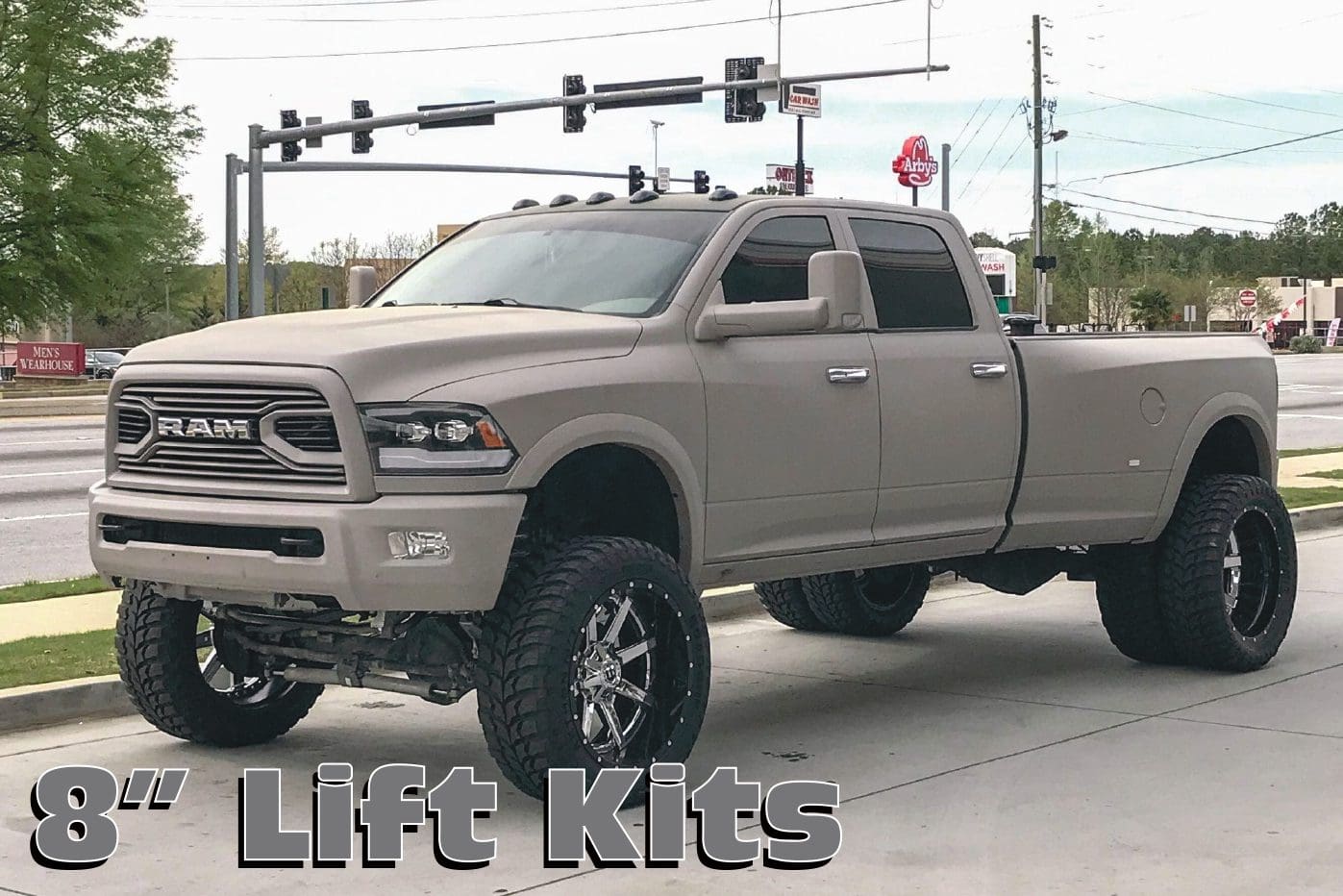 A truck with lift kits on it's bed.