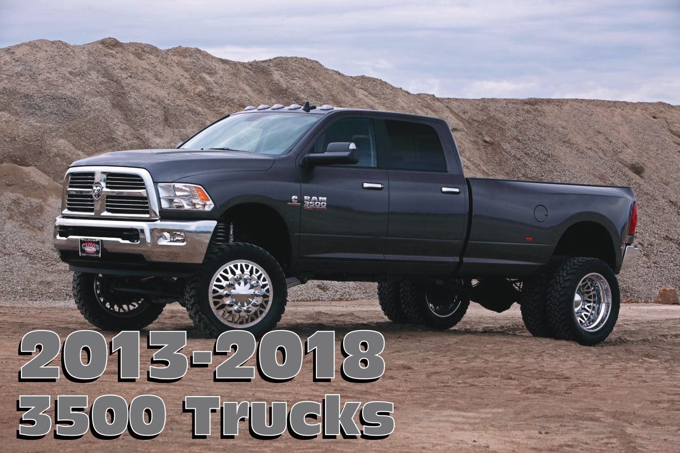 Black Ram 3500 pickup truck on dirt.