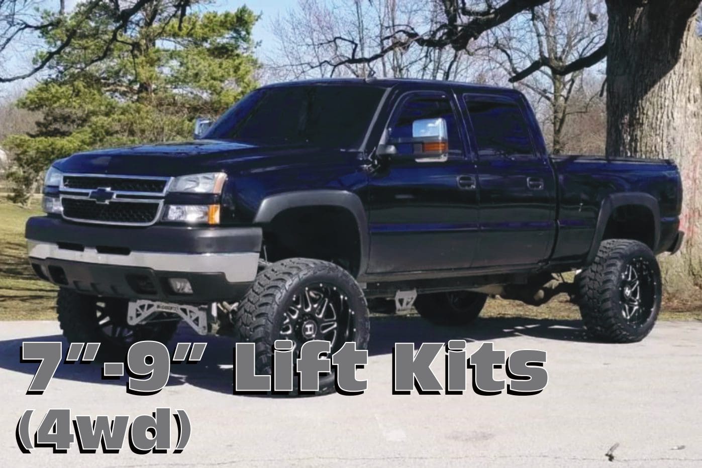 Black truck with lift kit and large tires.