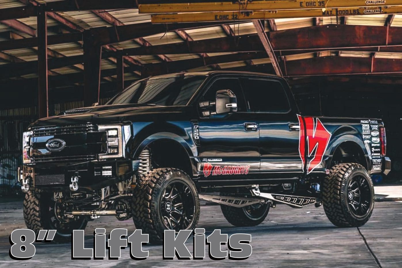 A black truck with red and white lettering on it.