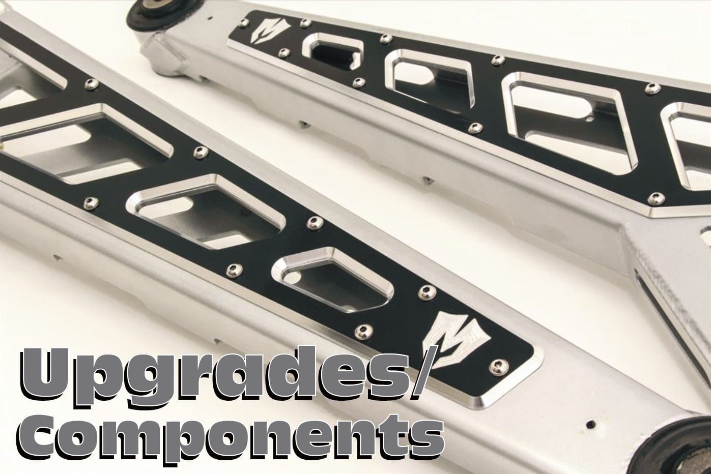 A pair of black and white metal frames with the words " upgrades / components ".