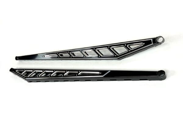 A pair of black and silver skis with the bottom half of each side.